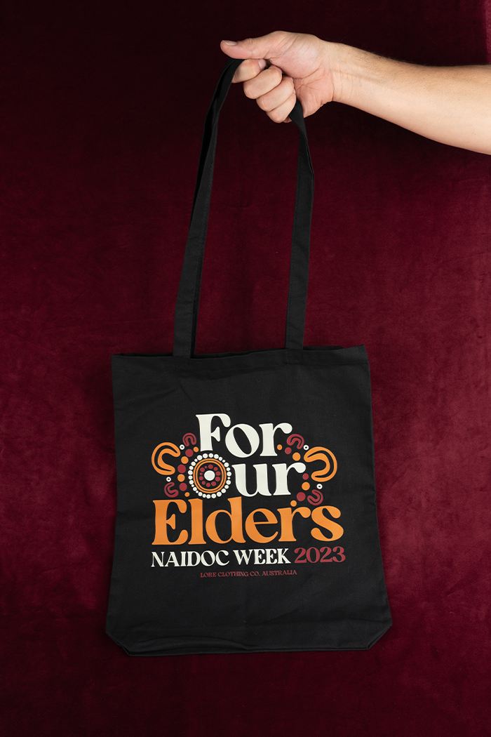 "For Our Elders" (Red & Yellow) NAIDOC WEEK 2023 Black Cotton Tote Bag